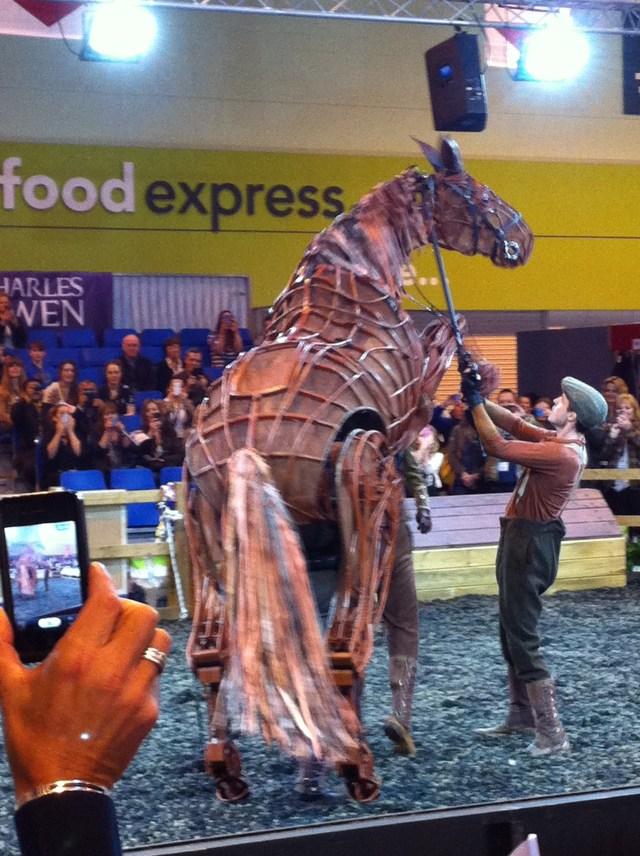 Close up, this is HUGE--well over 18hh. People move around him and interact with him, exactly as if he were a real horse. The real horses, of course, were cautiously embarrassed, pretty sure he wasn't a horse...but...um. In good British fashion they kind of went along with it.